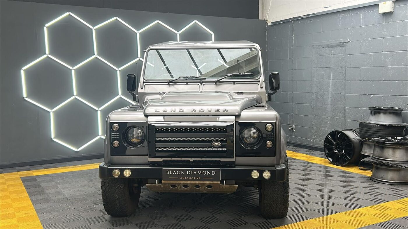 Land Rover Defender 90 front view, black grille and bumper